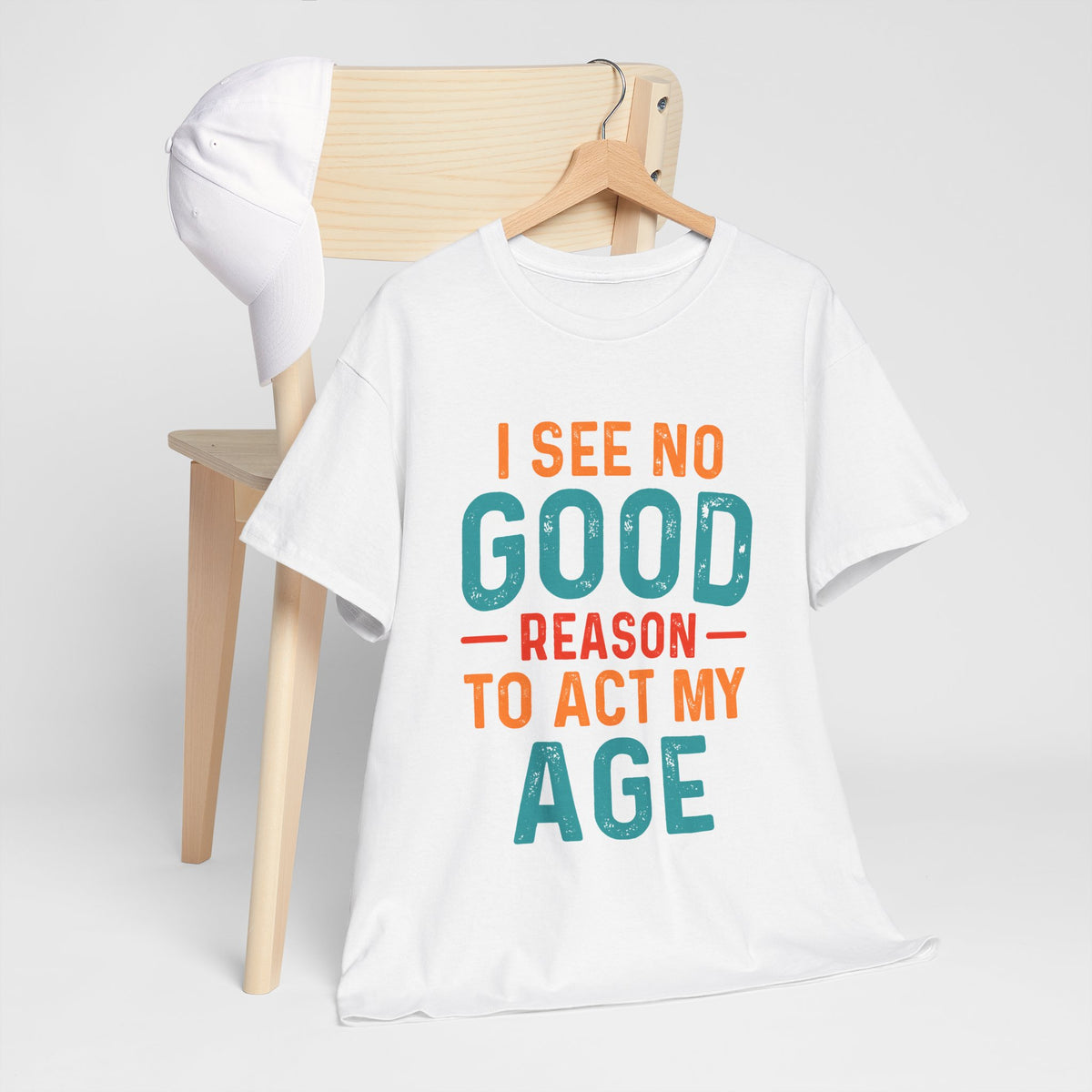 I See No Good Reason To Act My Age – Unisex Heavy Cotton Tee